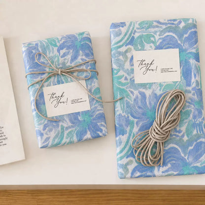 Blue tissue paper gift wrapping with cord